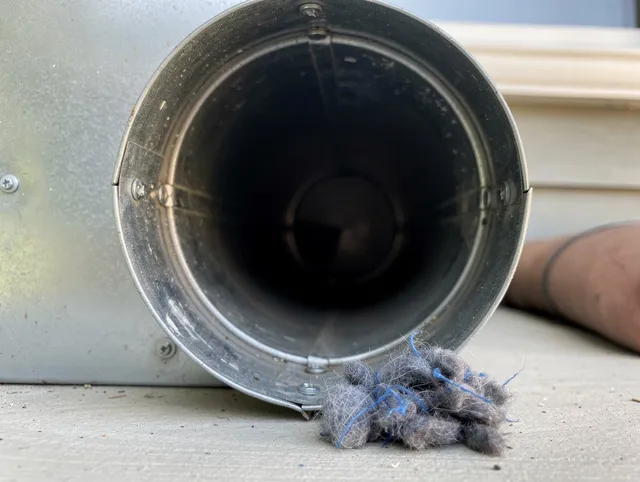 Muscoy Dryer Vent Cleaning technician using specialized equipment to clear severe dryer vent blockage in Muscoy